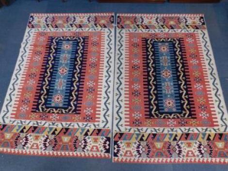 A pair of Turkish Topkapi machine made acrylic rugs