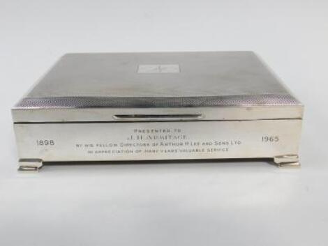 A silver rectangular cigarette box