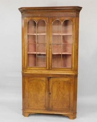 An oak and chestnut standing corner cabinet