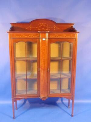 An Edwardian mahogany and marquetry display cabinet