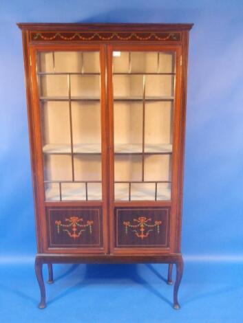 An Edwardian mahogany china cabinet with simulated marquetry decoration