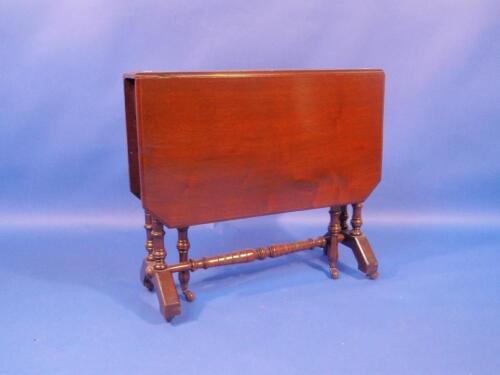 A Victorian walnut Sutherland table