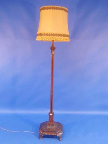 A Chippendale style mahogany cluster column standard lamp