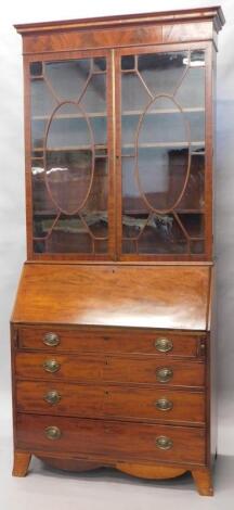 An early 19thC mahogany bureau bookcase