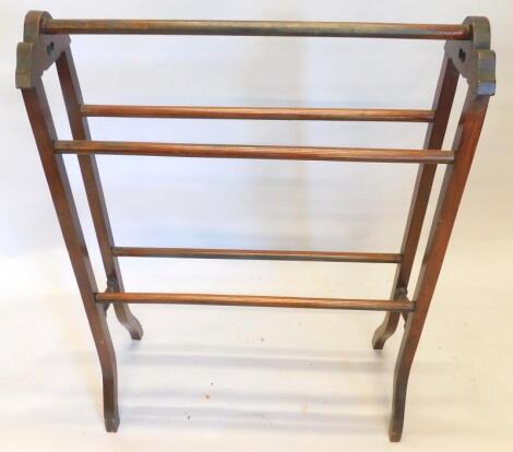 An Edwardian mahogany towel rail