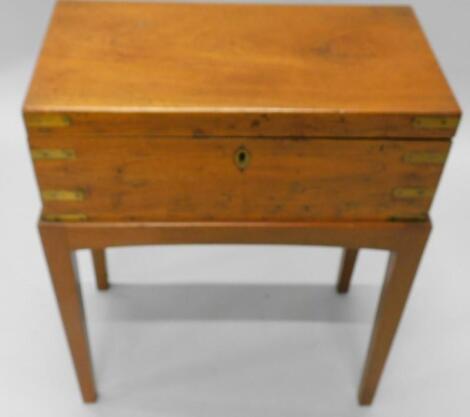 A 19thC teak and brass bound campaign style writing box