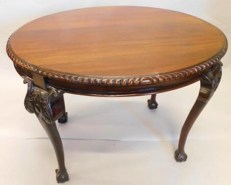 An early 20thC walnut oval occasional table