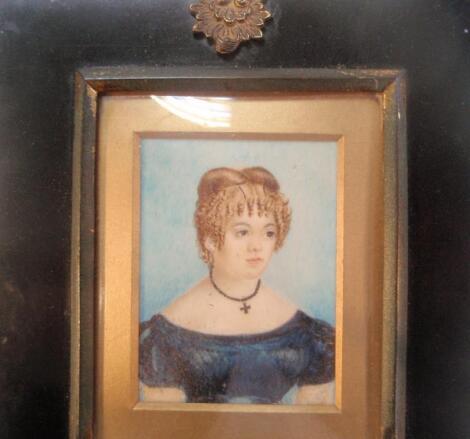 19thC School. A portrait miniature of a young lady