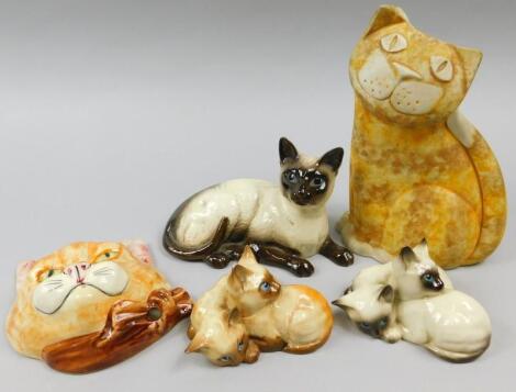 A collection of cat ornaments