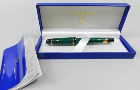 A Waterman green fountain pen