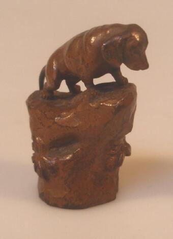 A miniature Austro German brown patinated bronze figure of a Dachshund