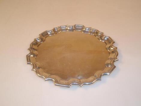 An Edwardian silver card tray with stepped everted rim