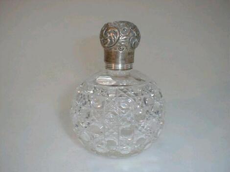 A Victorian cut glass scent bottle of globular form with hobnail and diamond cut design