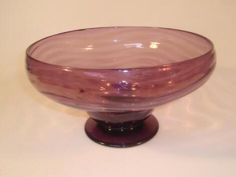 An amethyst glass pedestal bowl of inverted baluster form with wavy ribbed