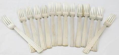 A set of fourteen Georg Jensen Bernadotte pattern sterling forks