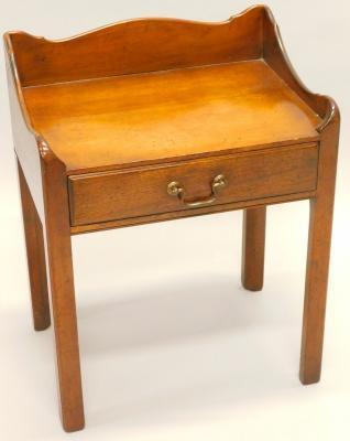 A mahogany bedside table