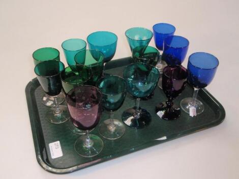 A quantity of Victorian wine glasses in greens