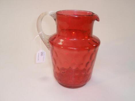 A cranberry glass jug
