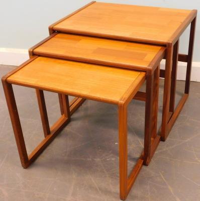 A nest of three teak retro style tables in 'G' plan style