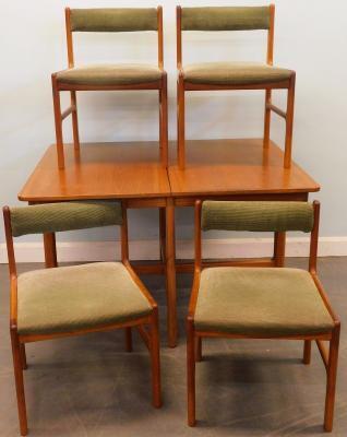 A G-Plan teak extending dining table and four chairs