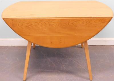 An Ercol light elm drop leaf oval kitchen table and six chairs - 2