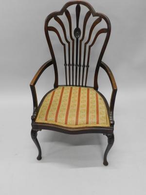 An Edwardian mahogany open armchair