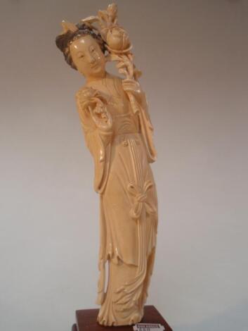 A Japanese ivory okimono figure of a Geisha on a hardwood stand