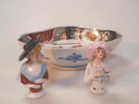 A small Japanese lozenge dish and two porcelain half dolls