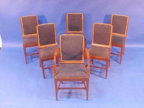 A set of six Art Deco walnut dining chairs including carver