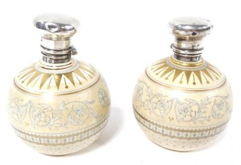 A pair of Victorian silver and pottery George Jones perfume bottles