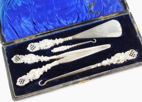 An Edwardian silver handled travelling manicure set