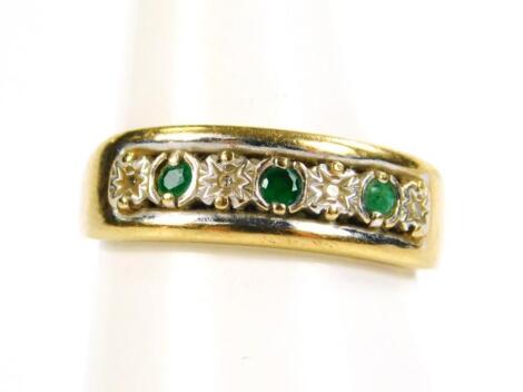 A 9ct gold emerald and diamond seven stone ring