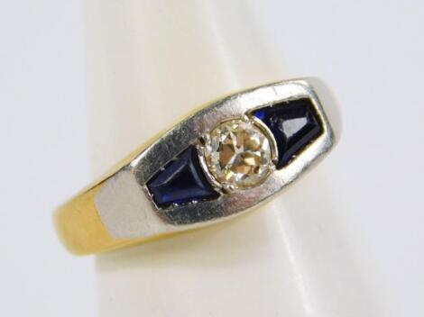 A diamond and sapphire three stone ring