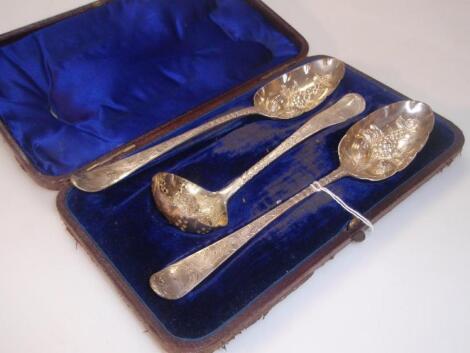 A pair of George III silver serving spoons and a matching castor spoon