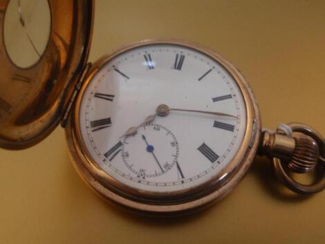 A gold plated half hunter pocket watch with large open linked Albert stamped 9c