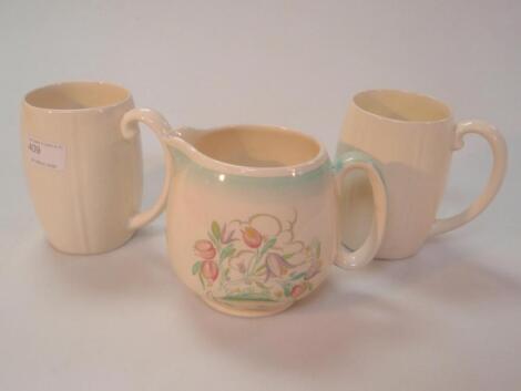 A Susie Cooper milk jug and two Keith Murray mugs