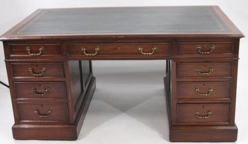 An early 20thC mahogany twin pedestal writing desk