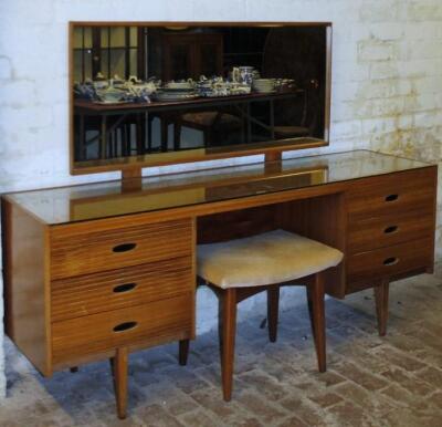 An Austinsuite 1960's teak six drawer mirror backed dressing table