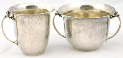 A Georg Jensen sterling twin handled sugar bowl and cream jug