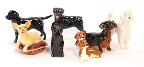 Seven Beswick pottery dogs