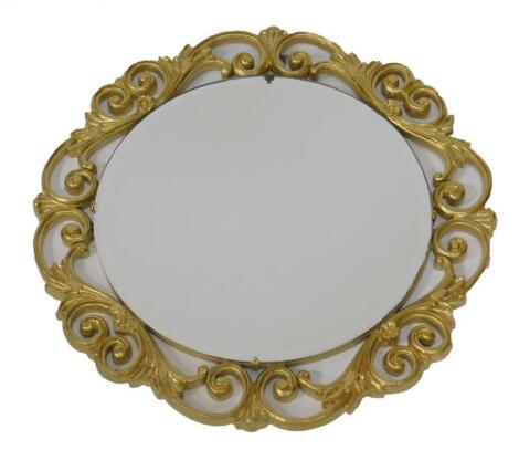 A 20thC circular gilt mirror