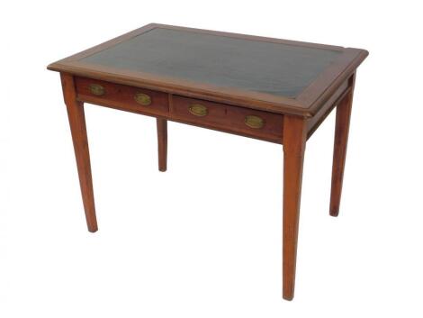 An Edwardian oak and mahogany writing table