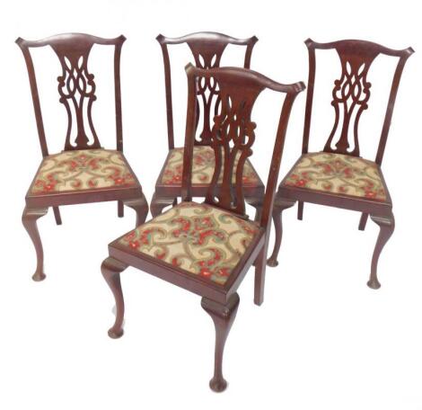 A set of four early Georgian style mahogany single dining chairs