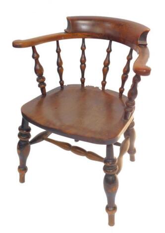 A Victorian oak and elm smoker's bow chair.