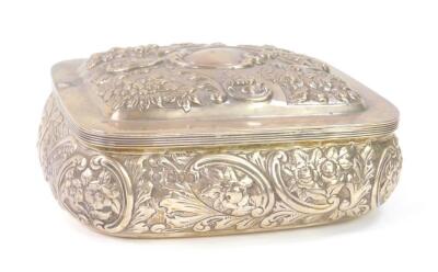 A Victorian silver box with a hinged lid