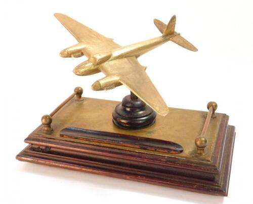 A mid 20thC brass and mahogany desk stand