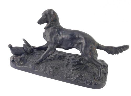 A Russian cast iron figure group of a dog and quail