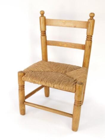 An early 20thC ash and rush seated child's chair