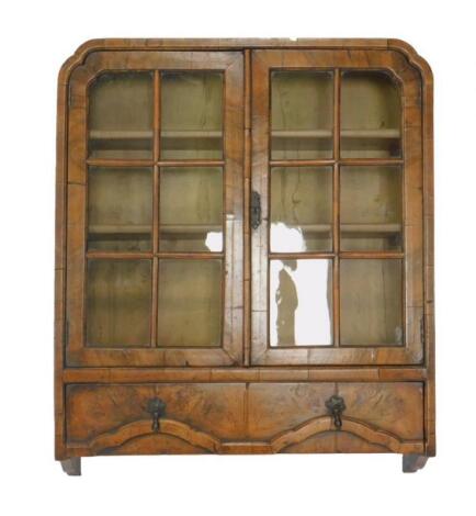 A William & Mary style walnut wall hanging display cabinet