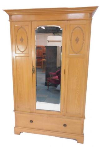 An Edwardian pine double wardrobe